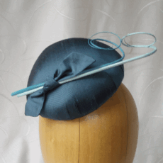 Teal silk cocktail hat with curled quills