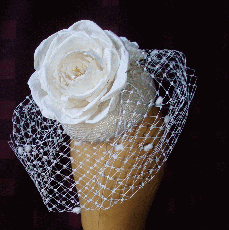 Straw button with hand made silk rose. 