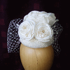 Straw button with hand made silk rose. 